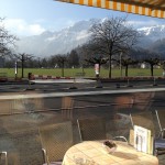 View of Street and Mountain from Cafe Des Alpes